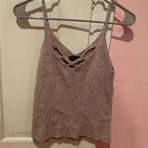 Large creme cropped tank top with a V neck cut out